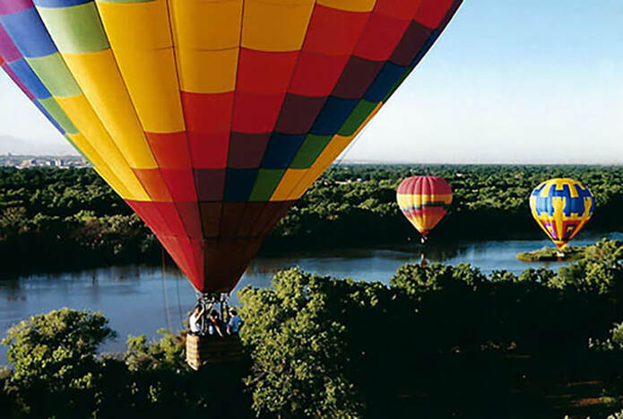Hot Air Balloons Floating Above The Rio Grande