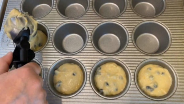 Frozen Wild Blueberry Muffins Scoop Batter into Muffin Tin