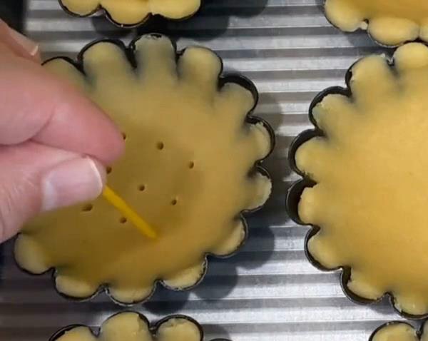 Mini Chocolate Tarts Prick Holes in Dough